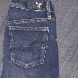 AE High Rise Ripped Med Wash Super Stretch Jeans